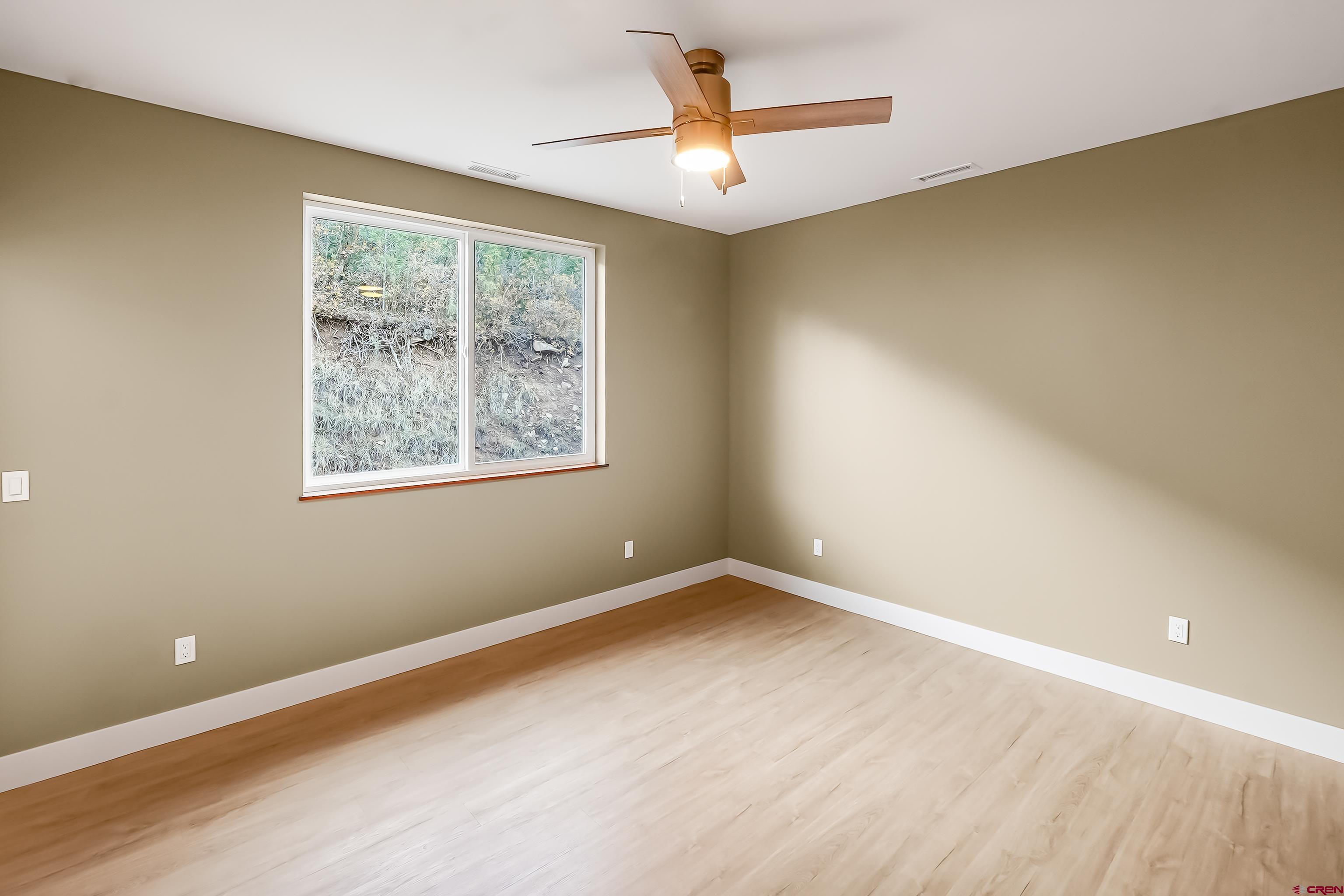 762 Goeglein Gulch Road, Unit 5 Durango, CO 81301 - Photo 25 of 43 a view of an empty room with a window