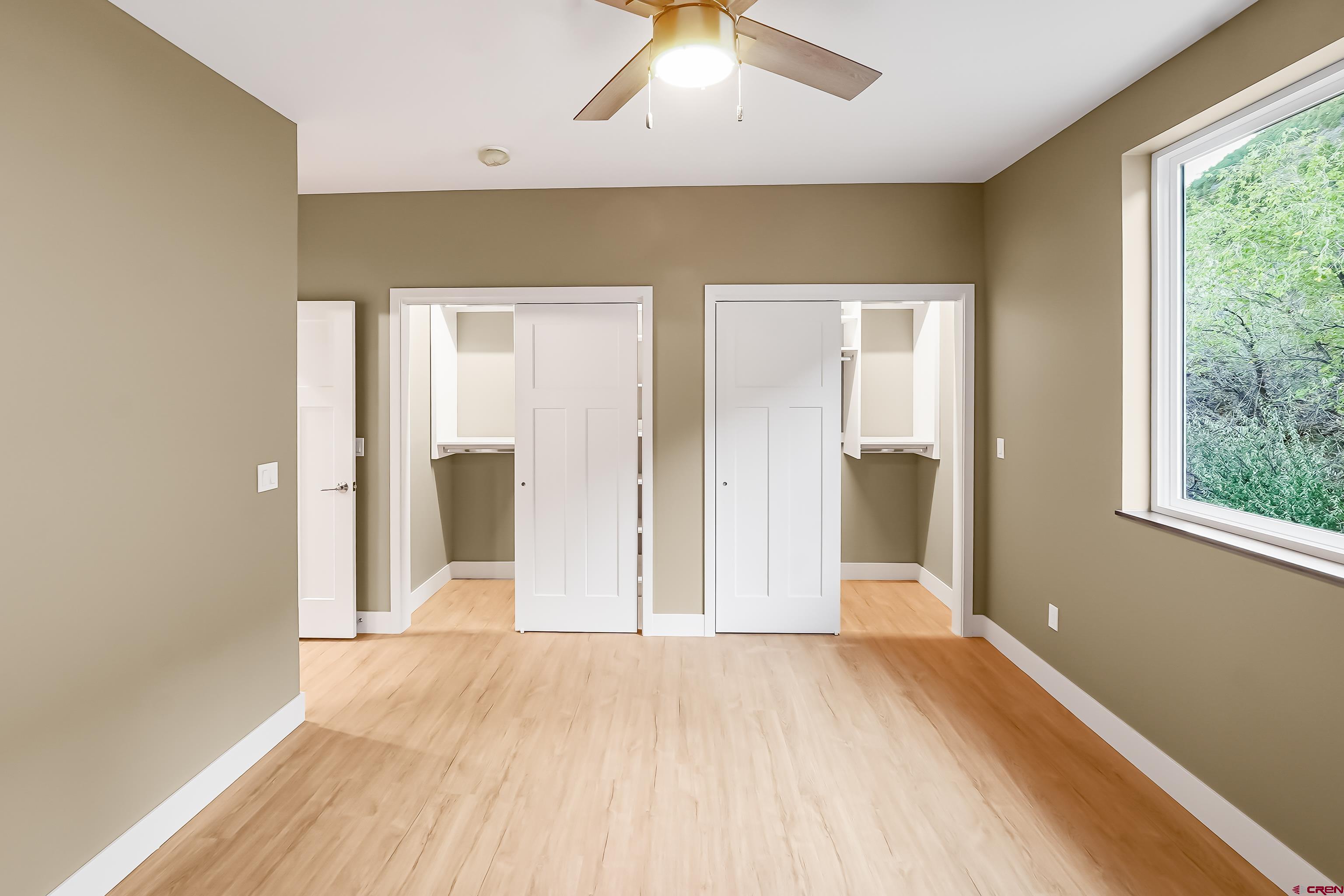 762 Goeglein Gulch Road, Unit 5 Durango, CO 81301 - Photo 27 of 43 wooden floor in an empty room with a window