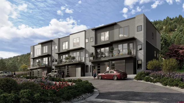 a car parked in front of a white building