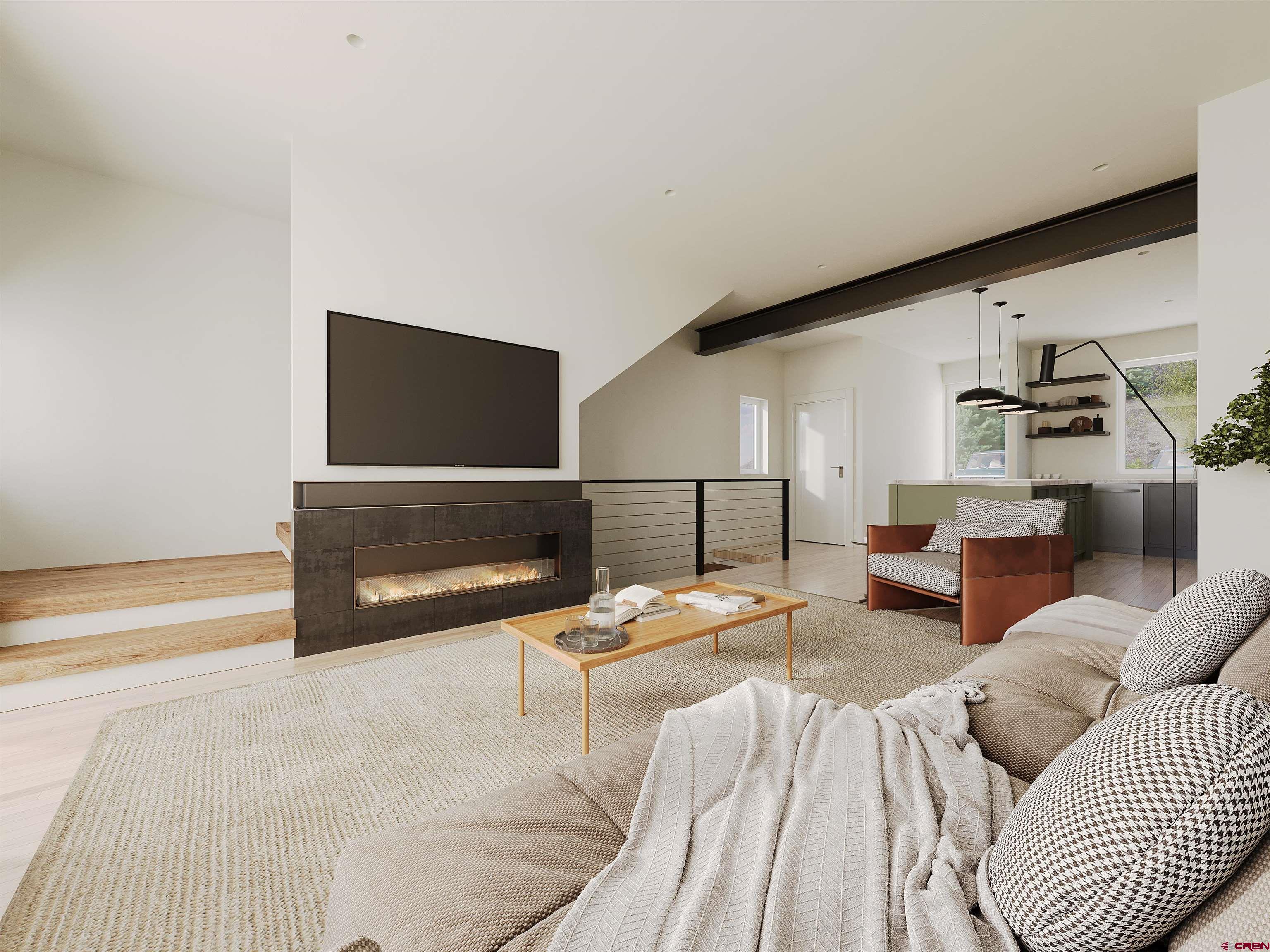 762 Goeglein Gulch Road, Unit 5 Durango, CO 81301 - Photo 32 of 43 a living room with furniture and a flat screen tv