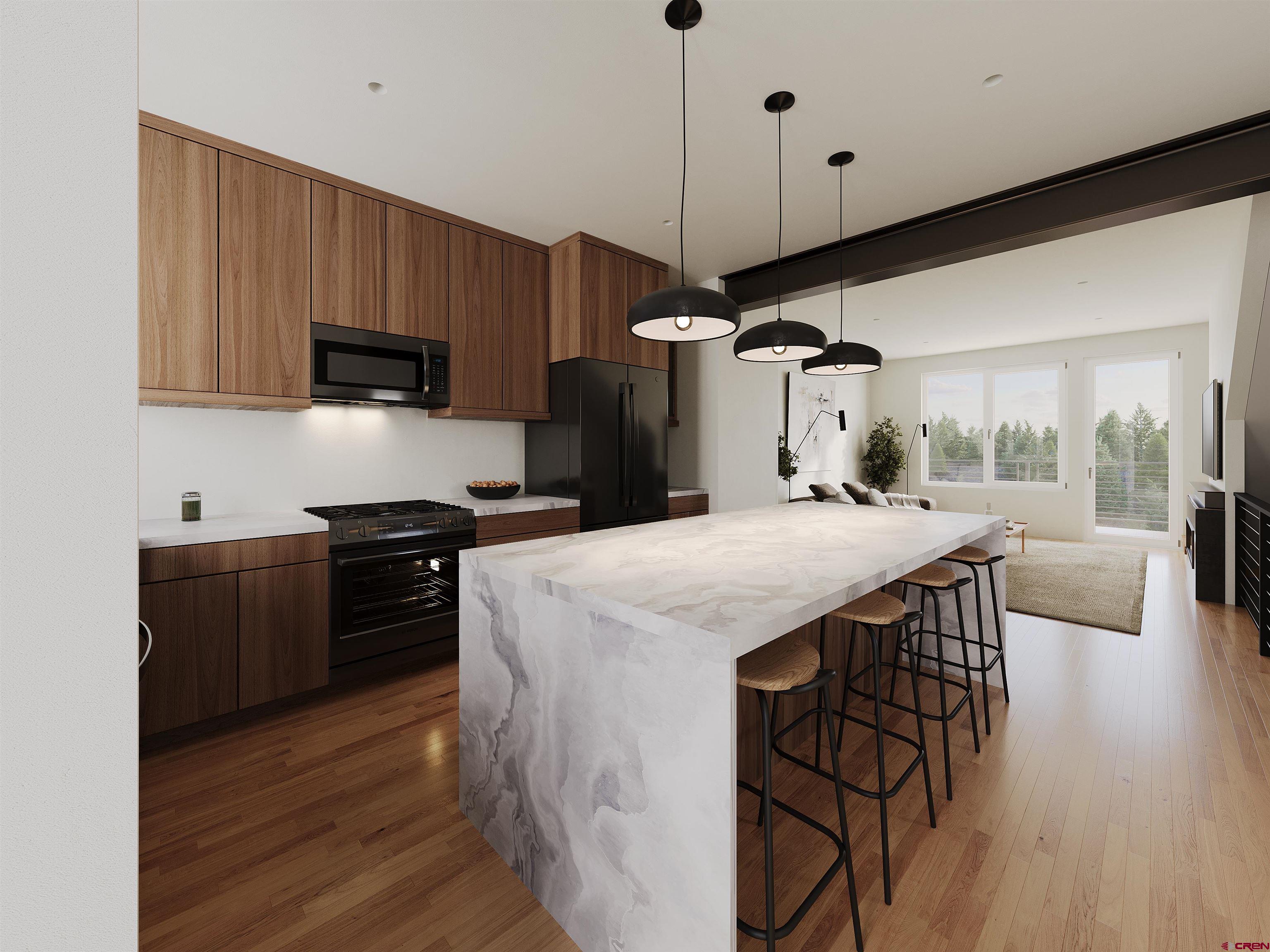 762 Goeglein Gulch Road, Unit 5 Durango, CO 81301 - Photo 38 of 43 a kitchen with stainless steel appliances a stove a sink a microwave a refrigerator and cabinets