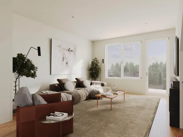 a kitchen with a table chairs stove and wooden floor