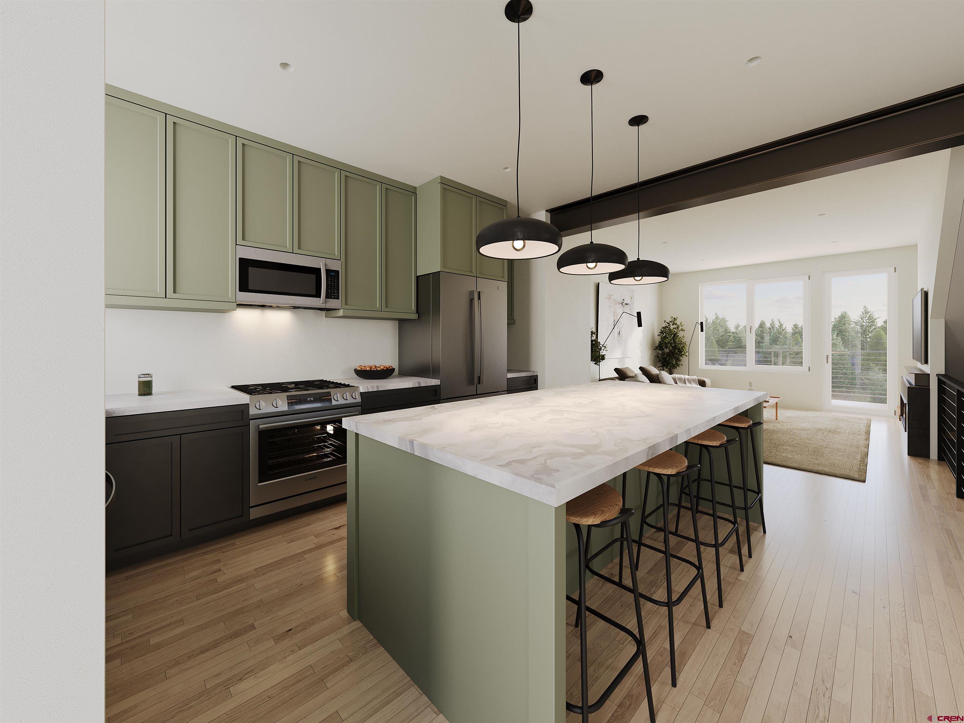 762 Goeglein Gulch Road, Unit 5 Durango, CO 81301 - Photo 40 of 43 a kitchen with a table chairs stove and wooden floor