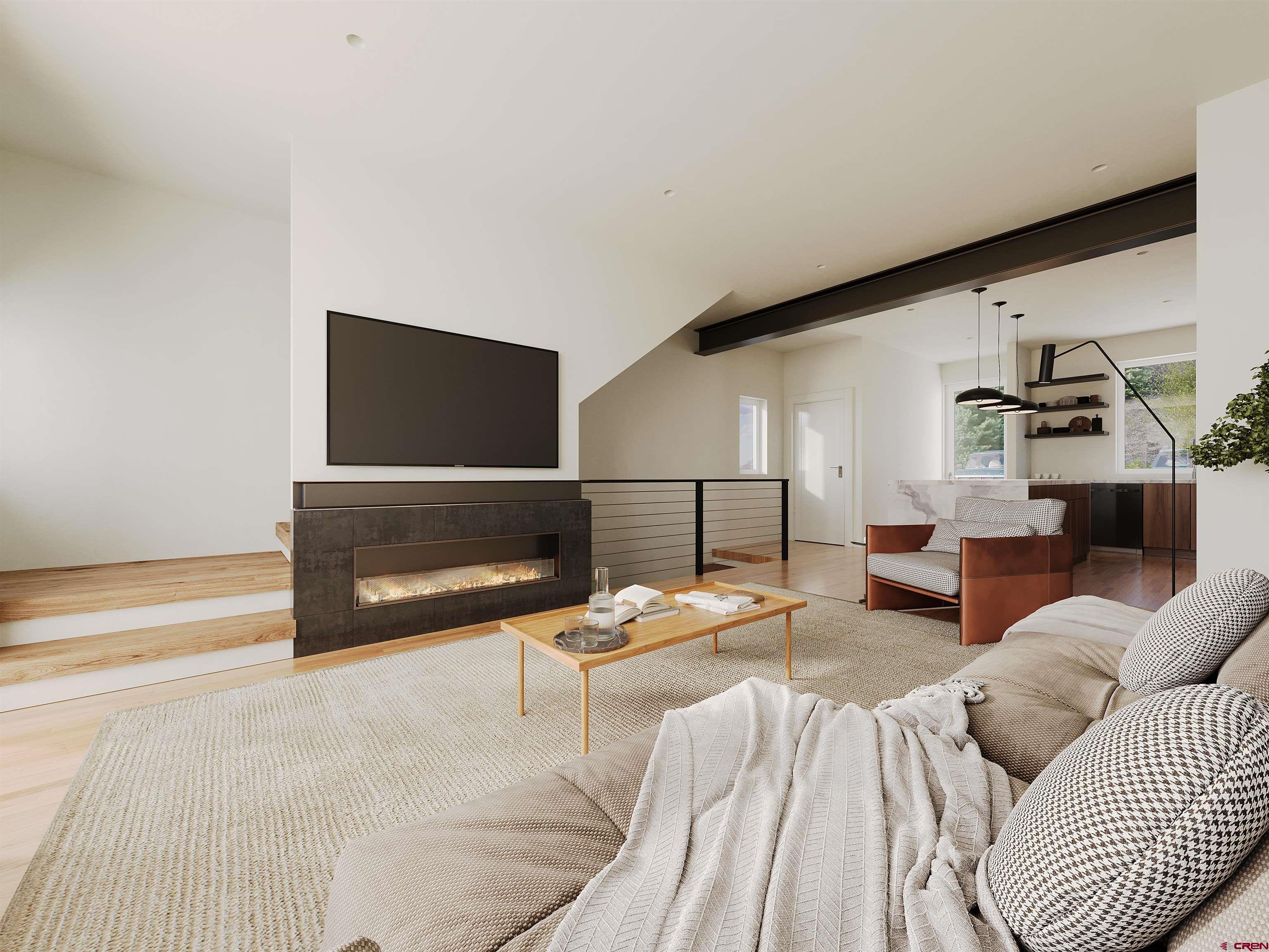 762 Goeglein Gulch Road, Unit 5 Durango, CO 81301 - Photo 42 of 43 a living room with furniture and a flat screen tv