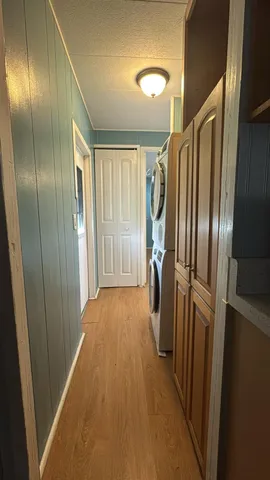 an empty room with closet and mirror