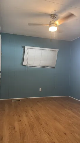 a white toilet sitting next to a shower