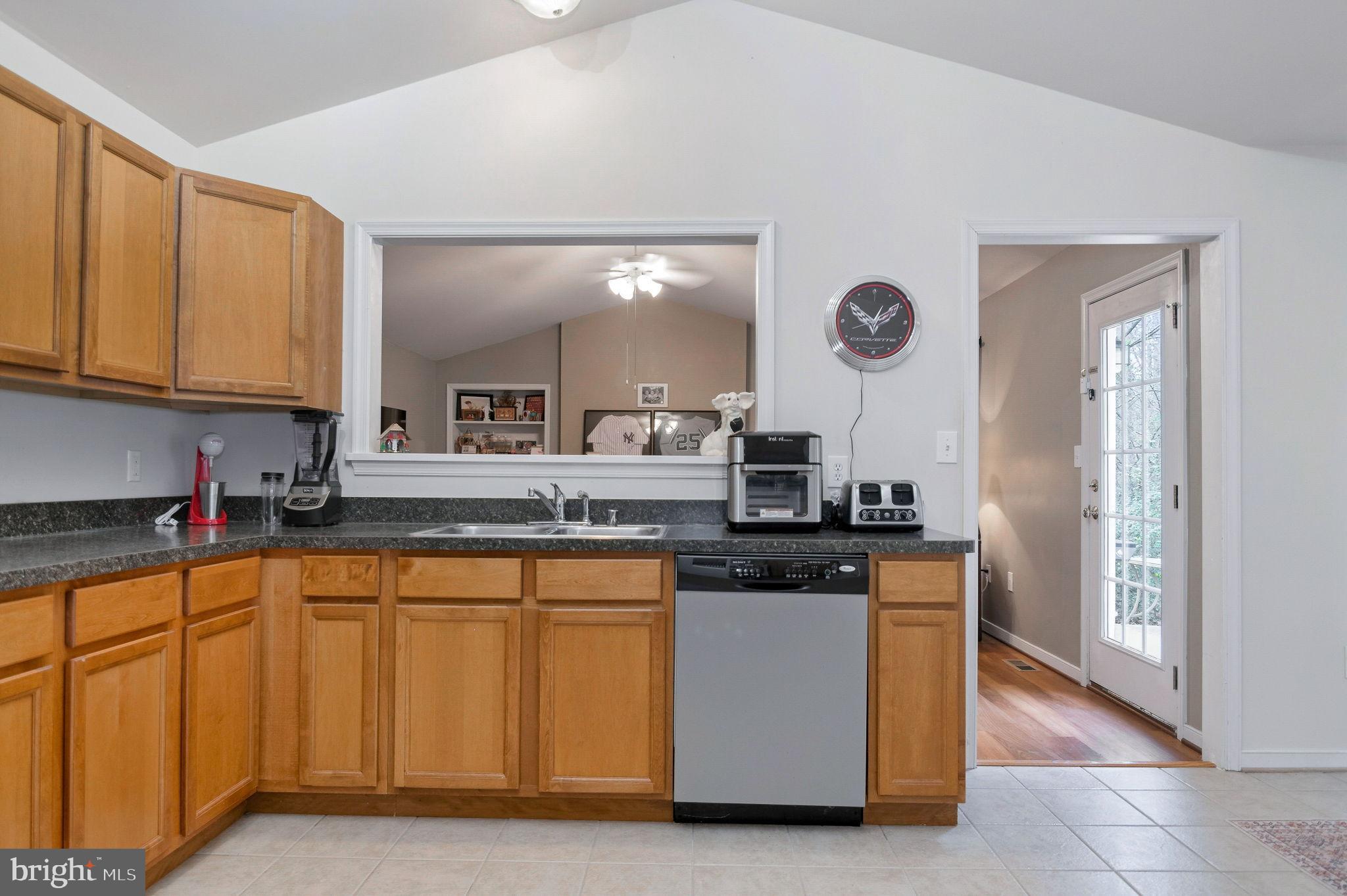 405 Harrison Circle Locust Grove, VA 22508 - Photo 11 of 33 a kitchen with stainless steel appliances granite countertop a stove and a sink