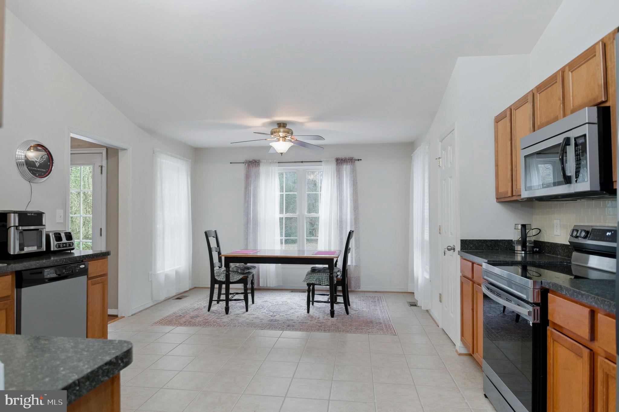 405 Harrison Circle Locust Grove, VA 22508 - Photo 14 of 33 a view of a dining room with furniture and chandelier