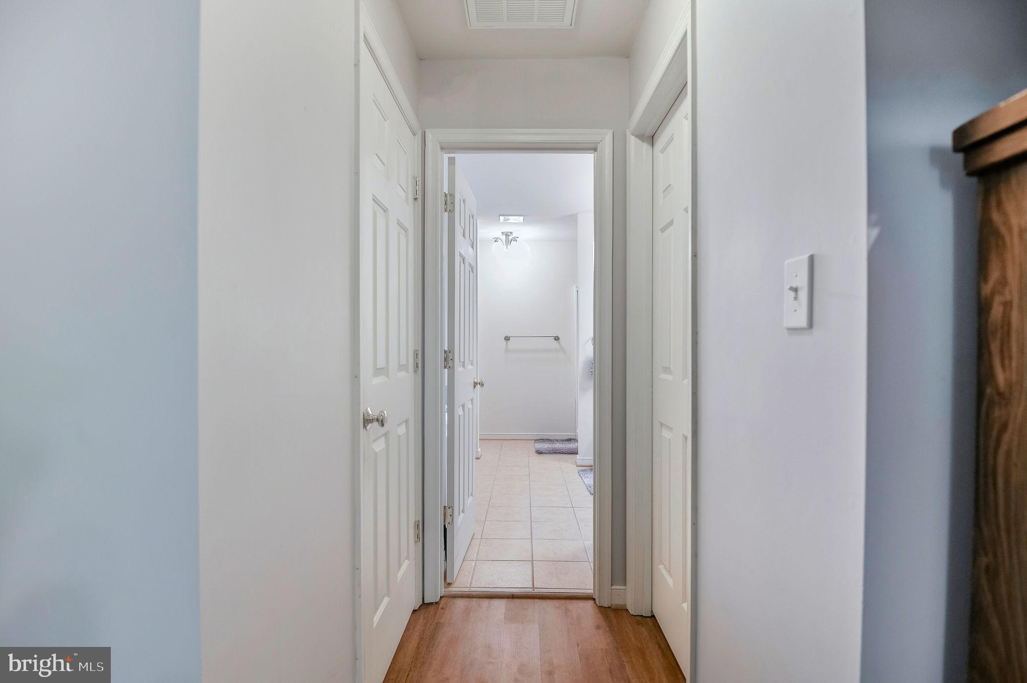 405 Harrison Circle Locust Grove, VA 22508 - Photo 17 of 33 a view of a hallway with wooden floor