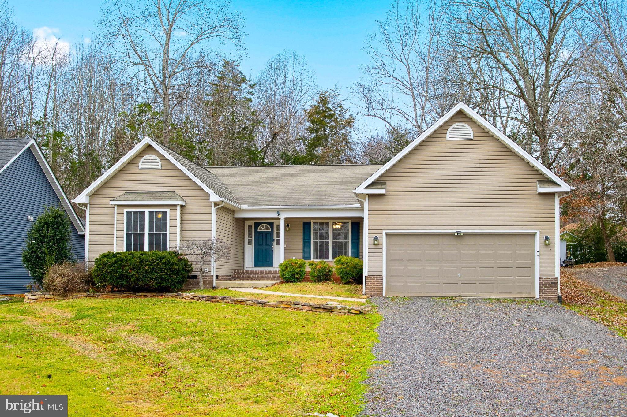 405 Harrison Circle Locust Grove, VA 22508 - Photo 2 of 33 a view of a house with yard and trees