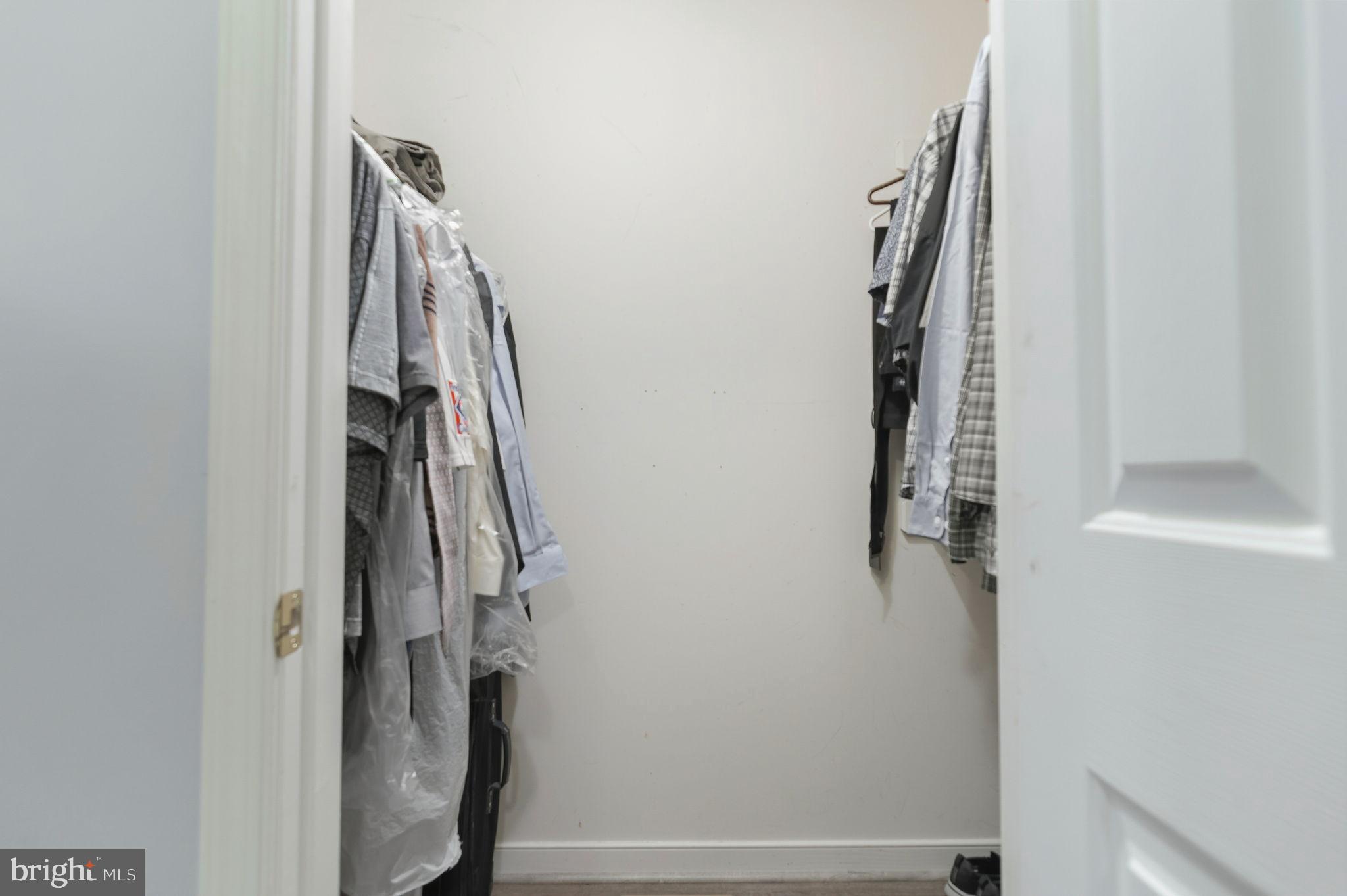 405 Harrison Circle Locust Grove, VA 22508 - Photo 22 of 33 a view of walk in closet with clothes