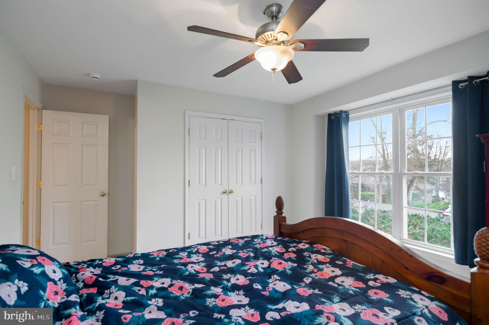 405 Harrison Circle Locust Grove, VA 22508 - Photo 24 of 33 a bedroom with bed and a chandelier