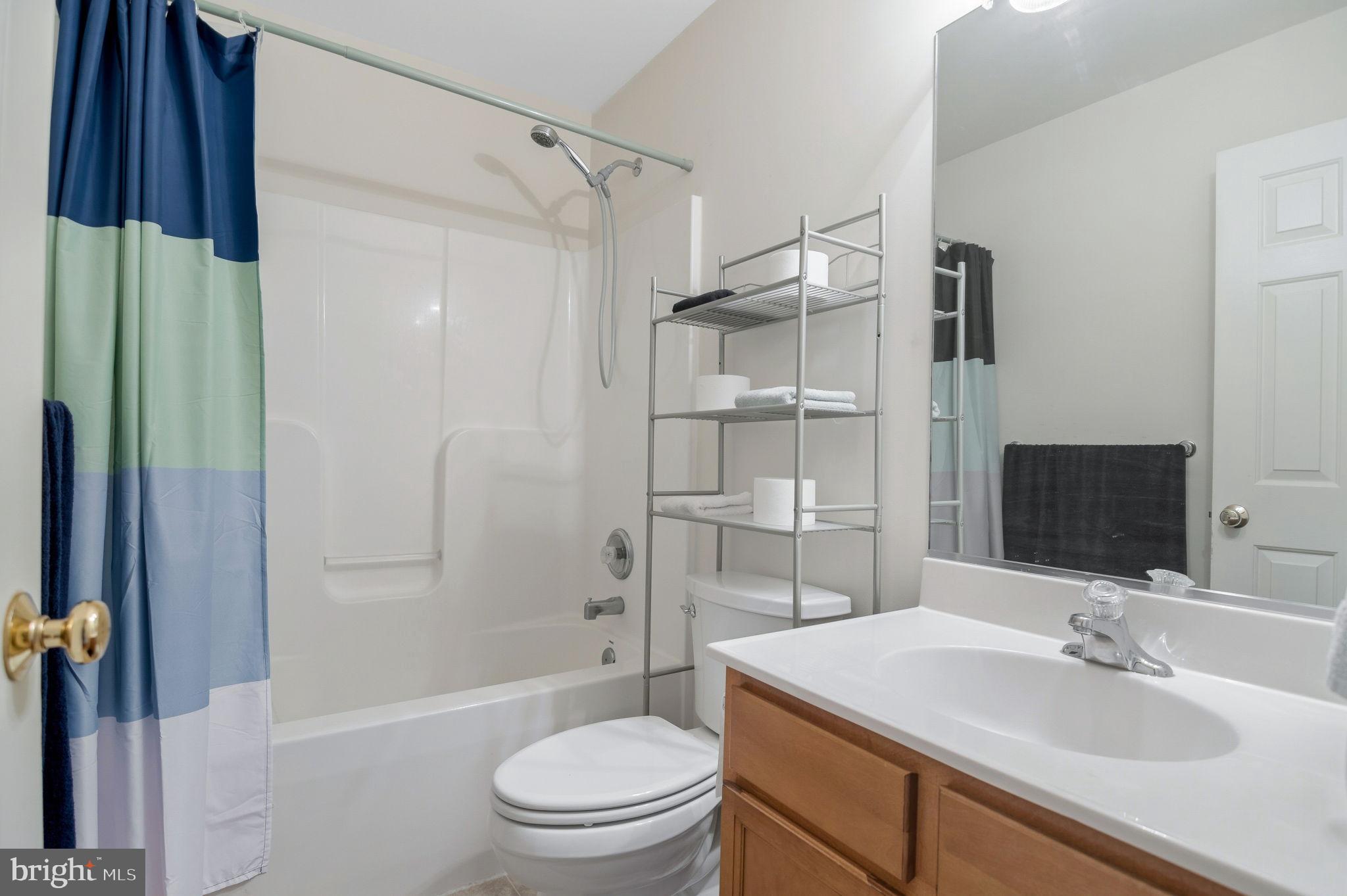405 Harrison Circle Locust Grove, VA 22508 - Photo 27 of 33 a bathroom with a sink toilet tub and shower