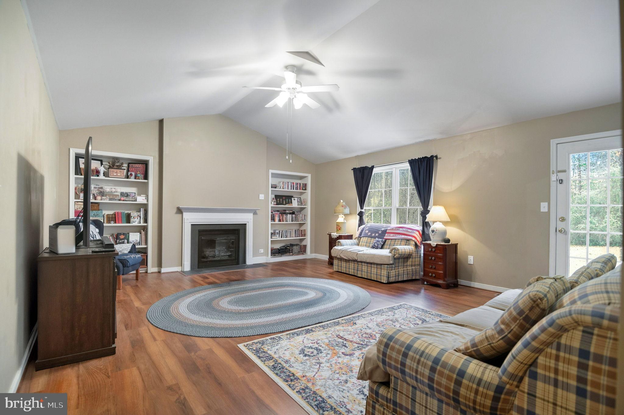 405 Harrison Circle Locust Grove, VA 22508 - Photo 7 of 33 a living room with furniture and a fireplace
