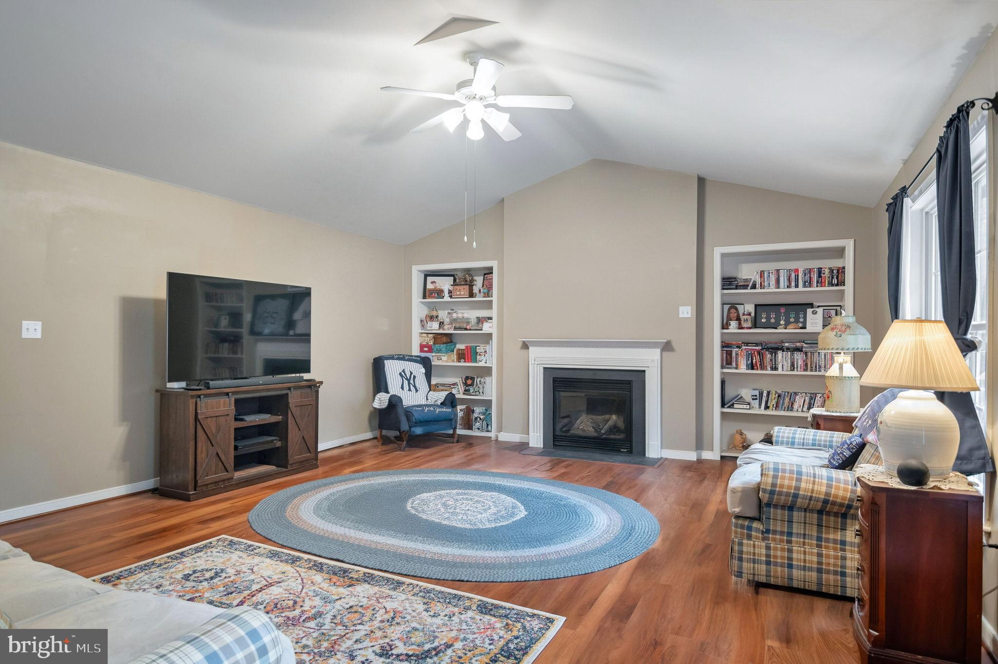 405 Harrison Circle Locust Grove, VA 22508 - Photo 8 of 33 a living room with furniture and a fireplace