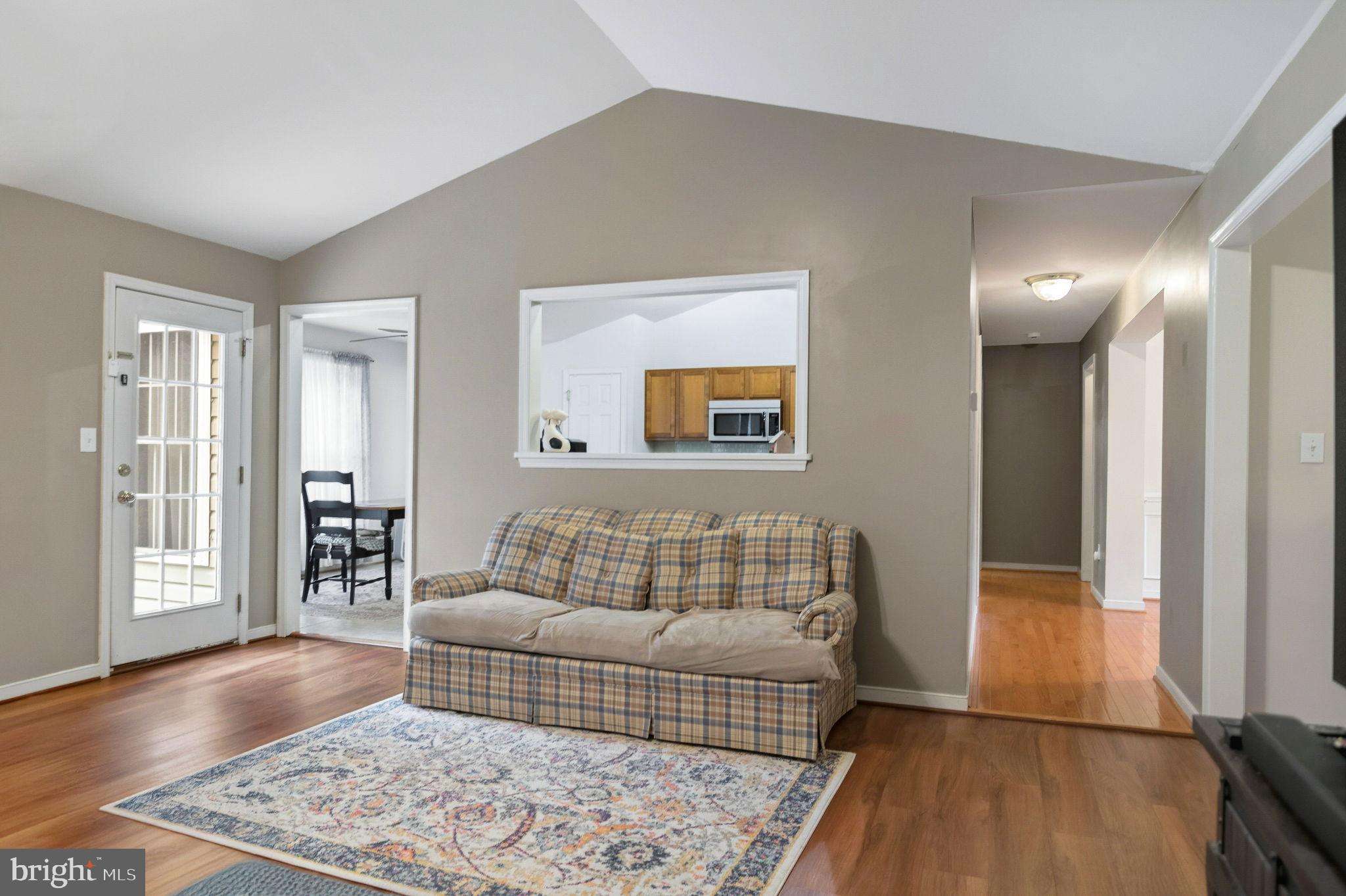 405 Harrison Circle Locust Grove, VA 22508 - Photo 9 of 33 a bedroom with a bed and wooden floor