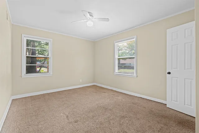 a view of an empty room with a window