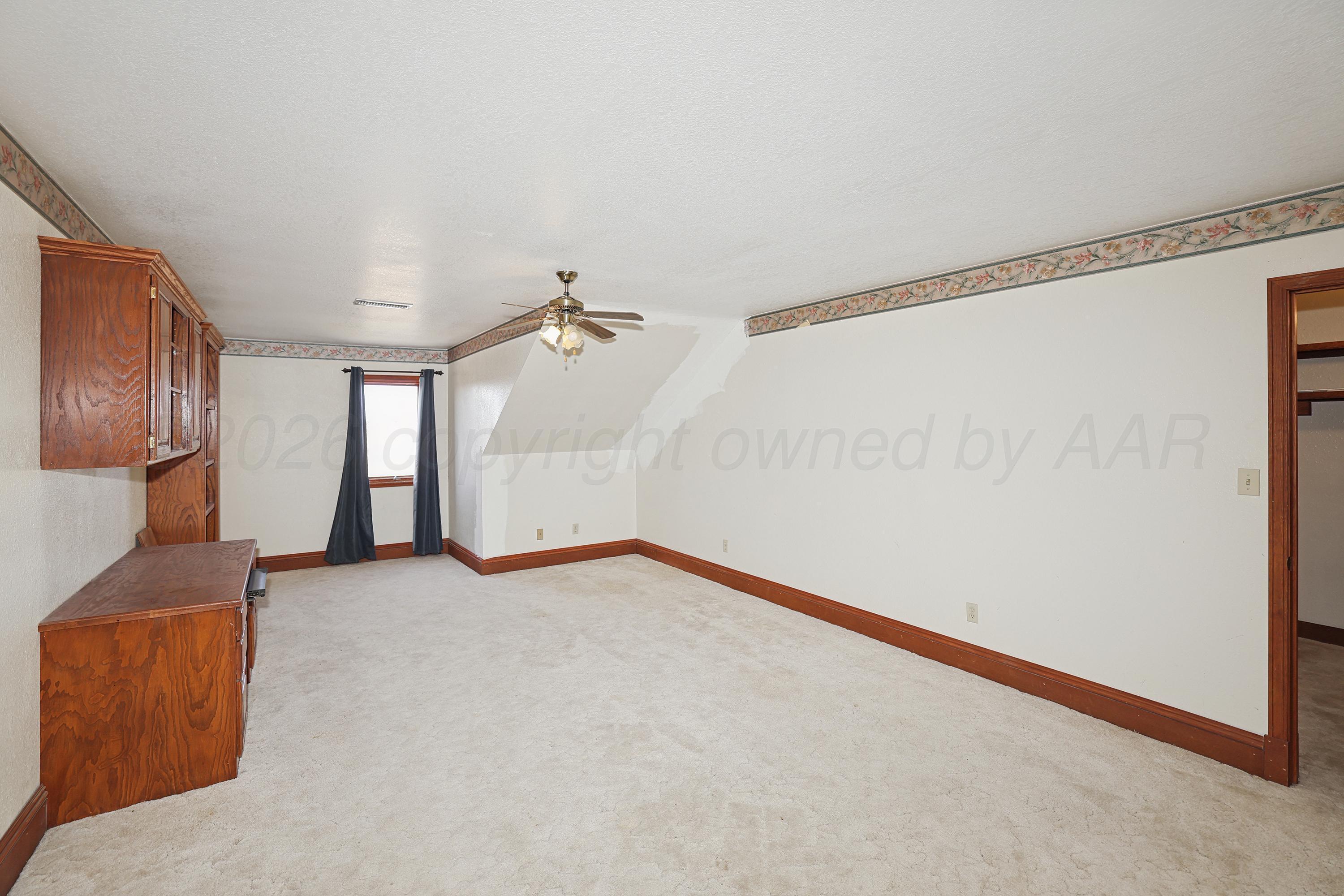 500 North Girl Scout Road Amarillo, TX 79124 - Photo 24 of 42 a view of a room with wooden floor and a ceiling fan