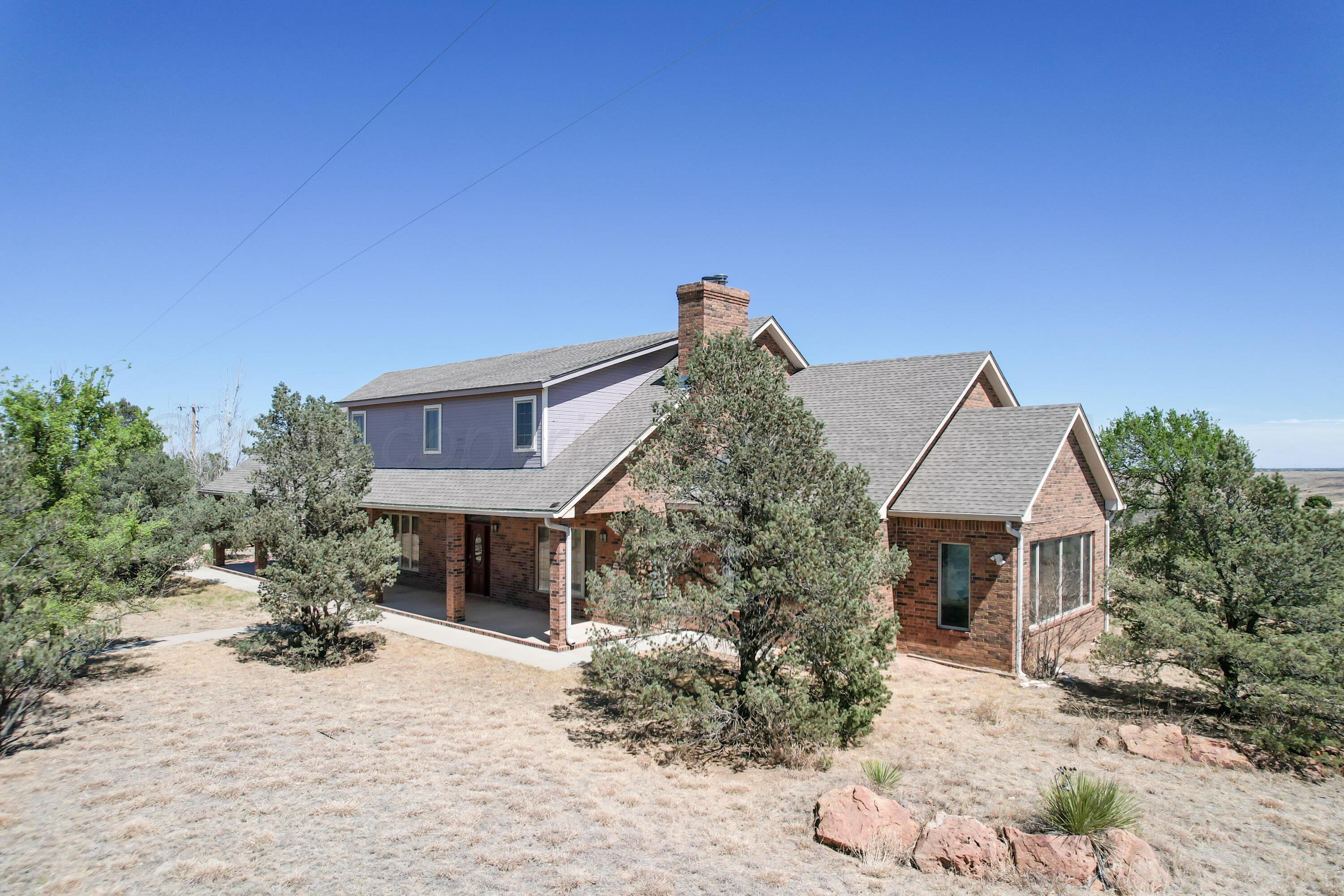500 North Girl Scout Road Amarillo, TX 79124 - Photo 4 of 42 a front view of a house with a yard