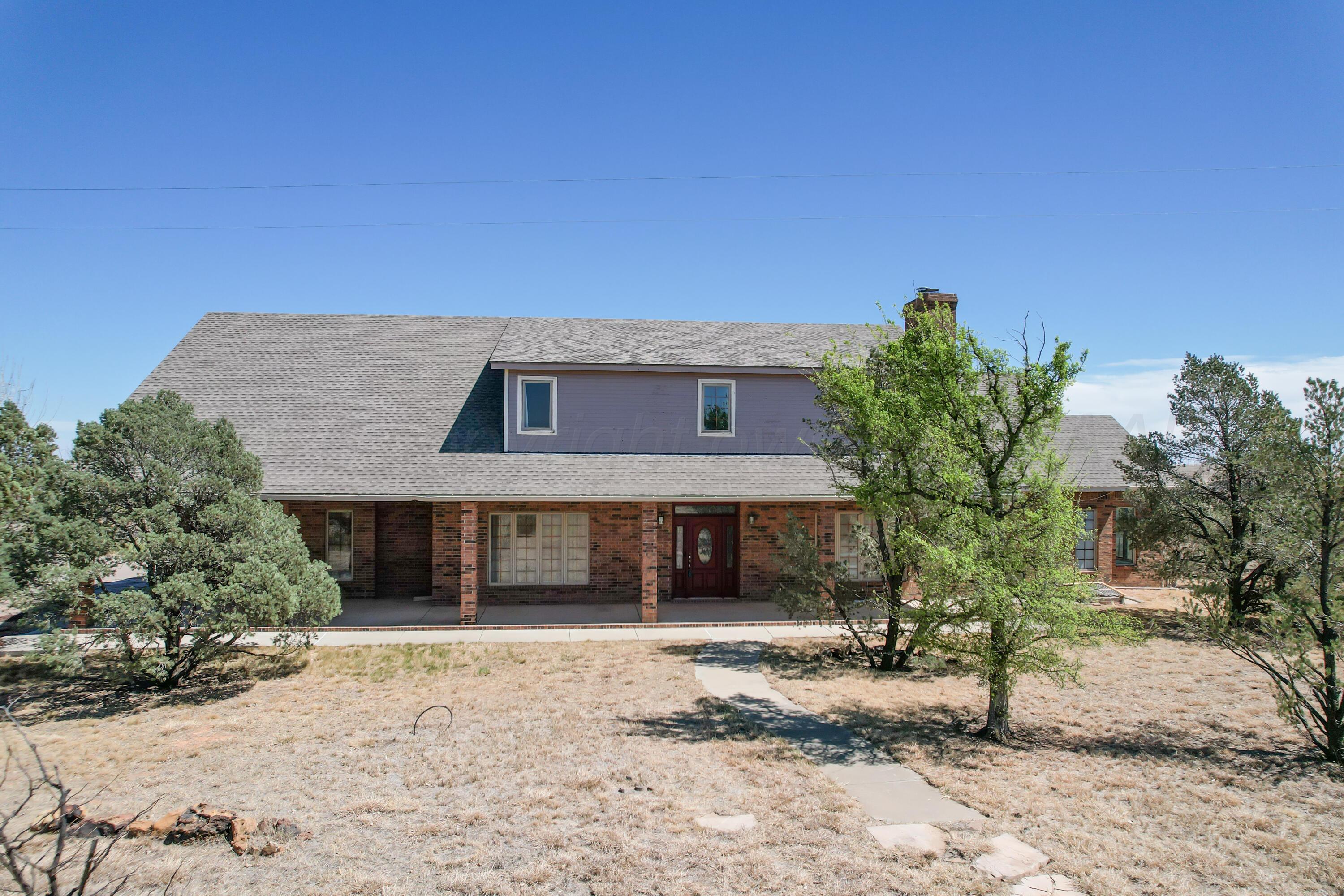 500 North Girl Scout Road Amarillo, TX 79124 - Photo 5 of 42 a front view of a house with a yard