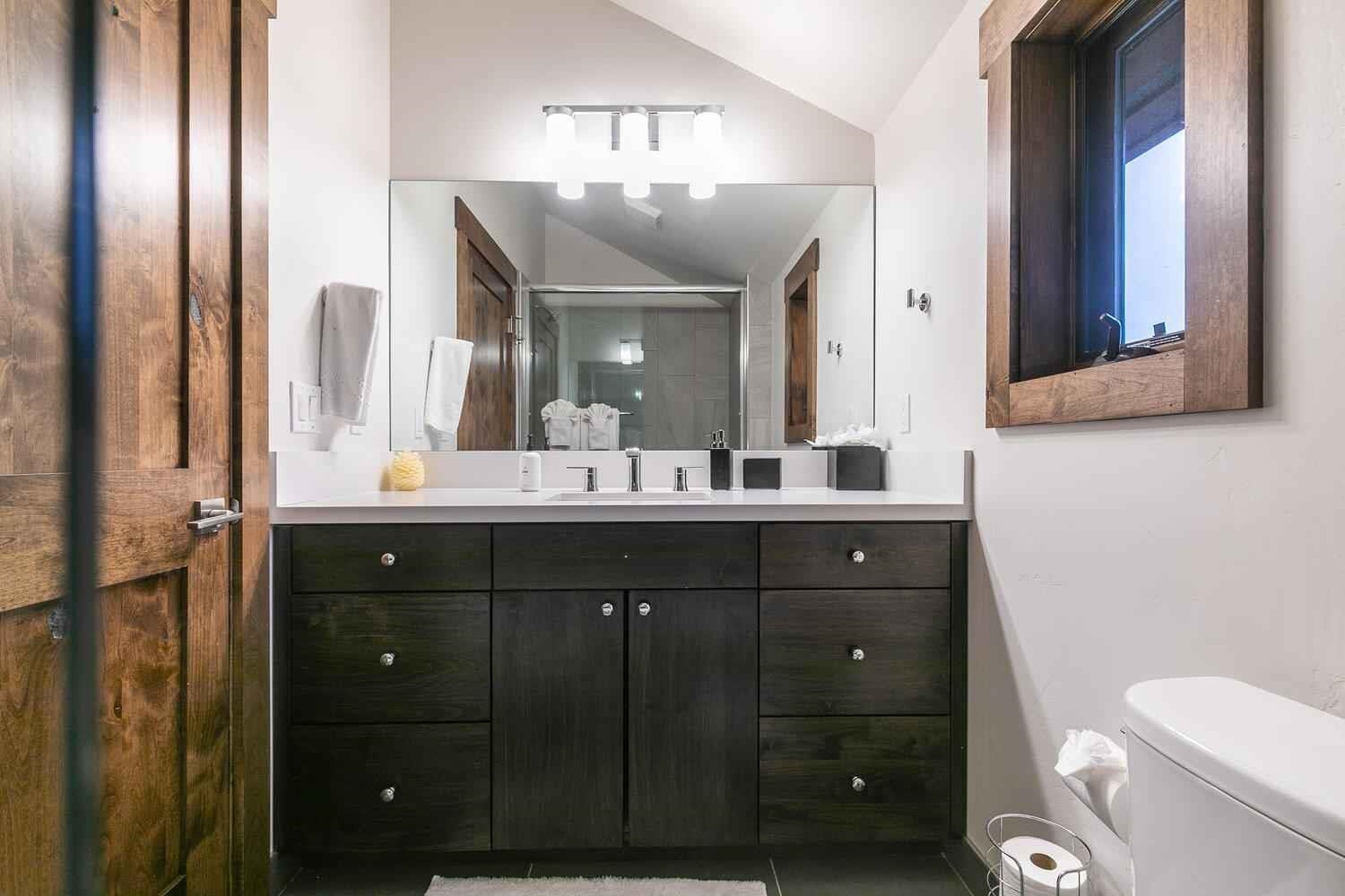 11655 Henness Road Truckee, CA 96161 - Photo 17 of 21 a bathroom with a sink vanity and mirror