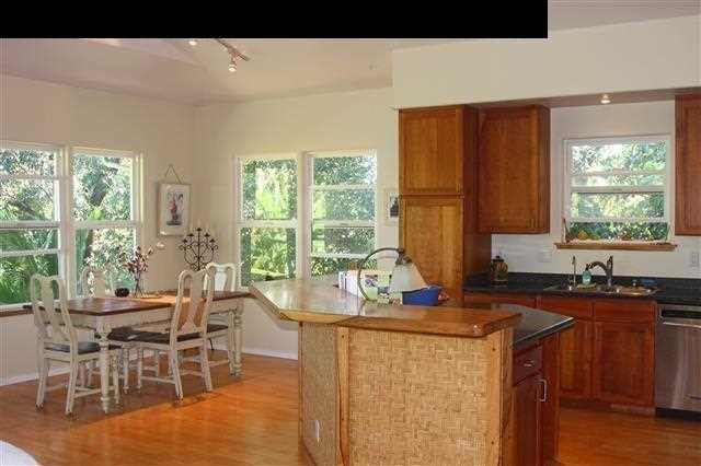 2575 Ala Olu Place Haiku, HI 96708 - Photo 3 of 11 a kitchen with a table chairs and a window