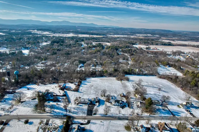 a large bedroom with a bed and a view of bedroom
