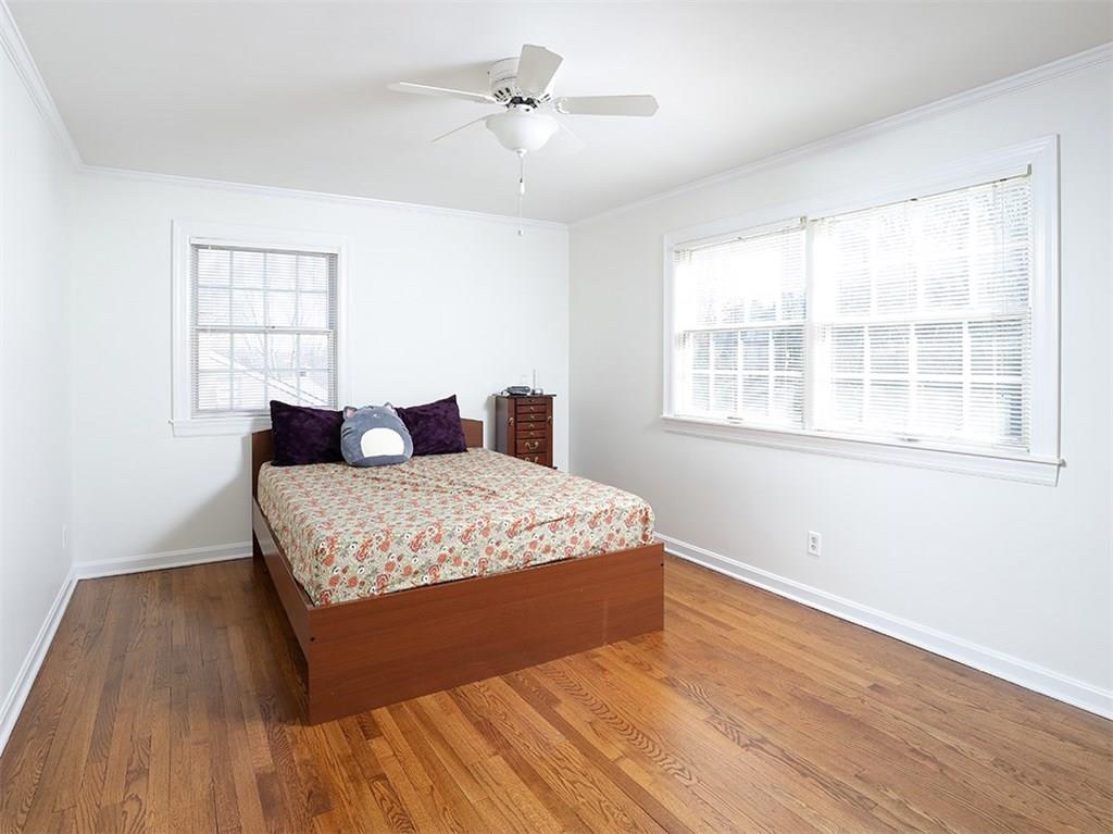 534 Harrogate Road Upper St. Clair, PA 15241 - Photo 17 of 25 Second bedroom with neutral freshly painted walls and hardwood flooring.
