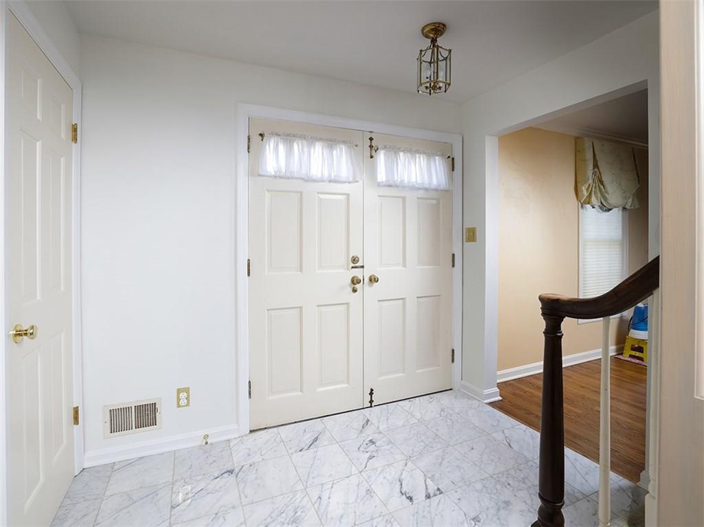 534 Harrogate Road Upper St. Clair, PA 15241 - Photo 3 of 25 Freshly painted walls and marble flooring welcomes you into the foyer that flows into the living room and the family room.