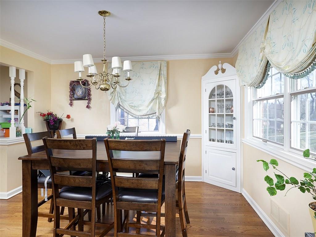 534 Harrogate Road Upper St. Clair, PA 15241 - Photo 5 of 25 Dining room with built in china cabinet, crown molding with hardwood flooring.