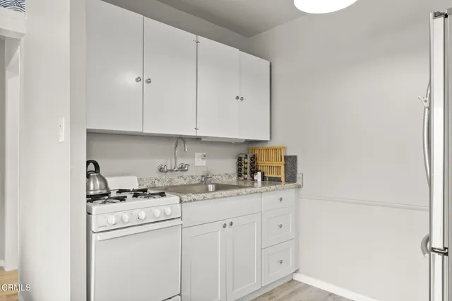 a bathroom with a sink a toilet and vanity