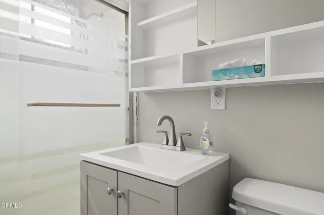 a kitchen with stainless steel appliances granite countertop a stove a refrigerator and a sink