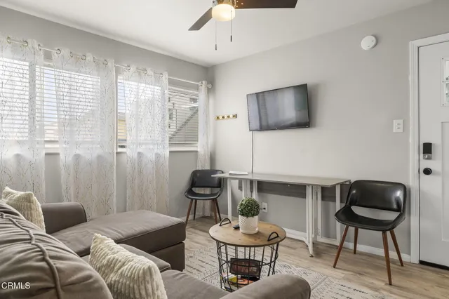 a bedroom with a bed and a lamp