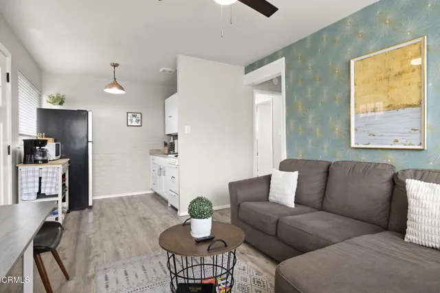 a bedroom with a bed and a lamp