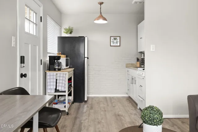 a living room with granite countertop furniture and a fireplace