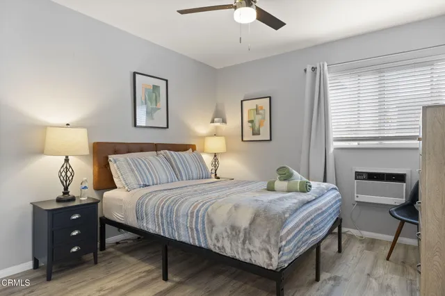 a bedroom with a bed and a table