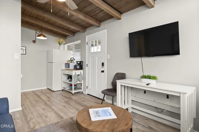 a kitchen with stainless steel appliances a stove microwave and a refrigerator