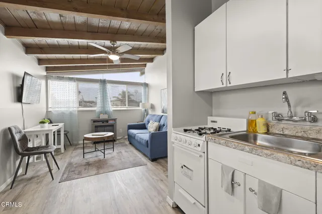 a bedroom with a bed and a chair