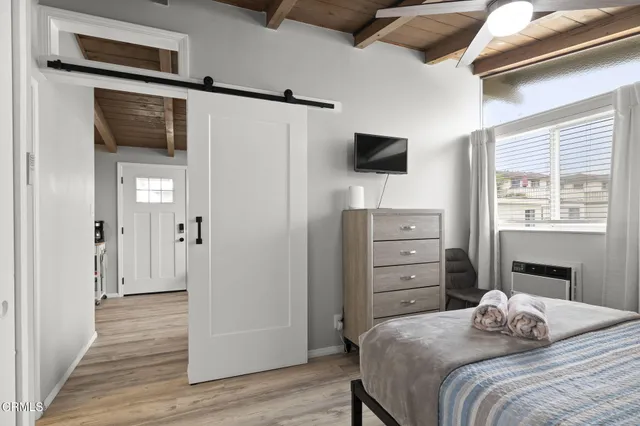 a view of a chair and tables in the patio