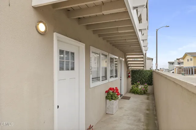 a view of a livingroom with furniture and a flat screen tv