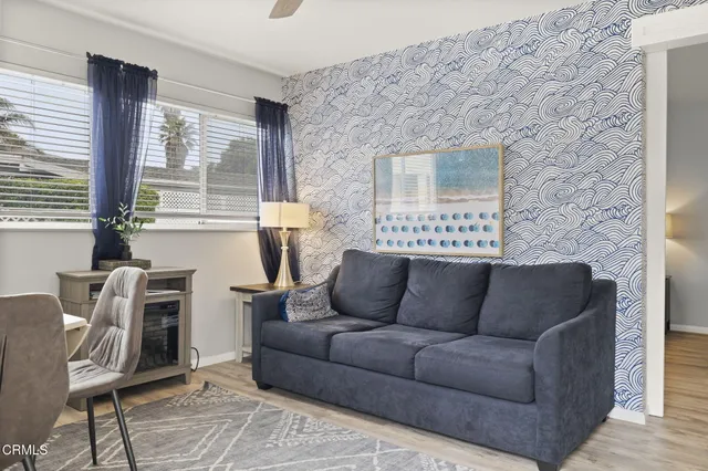 a kitchen with stainless steel appliances a stove refrigerator and microwave