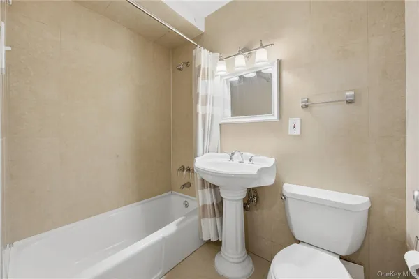 a bathroom with a sink toilet and bathtub