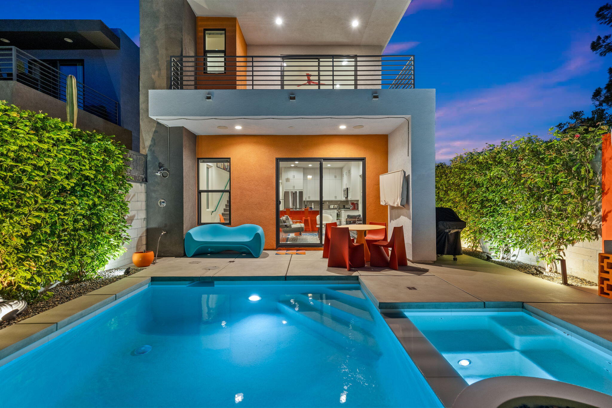 a backyard of a house with yard and outdoor seating