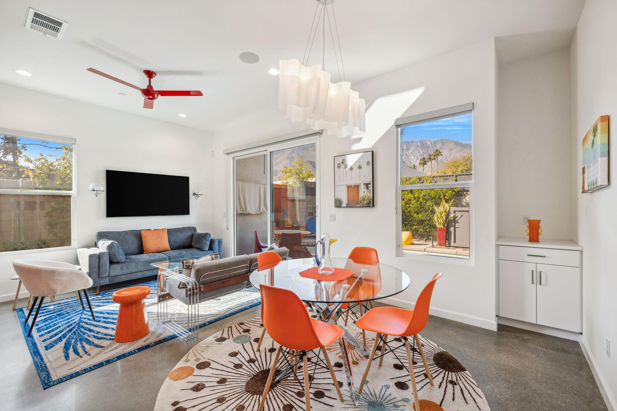 2691 Paragon Loop Palm Springs, CA 92262 - Photo 17 of 18 a living room with furniture a flat screen tv and a window