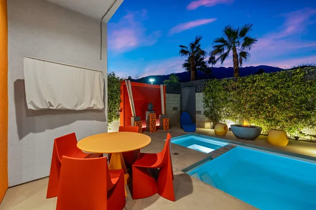 a view of a room with furniture and a potted plant
