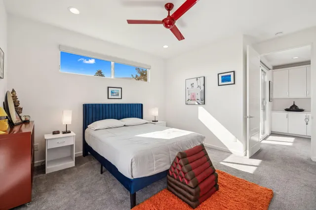 a bed room with a bed and a chandelier