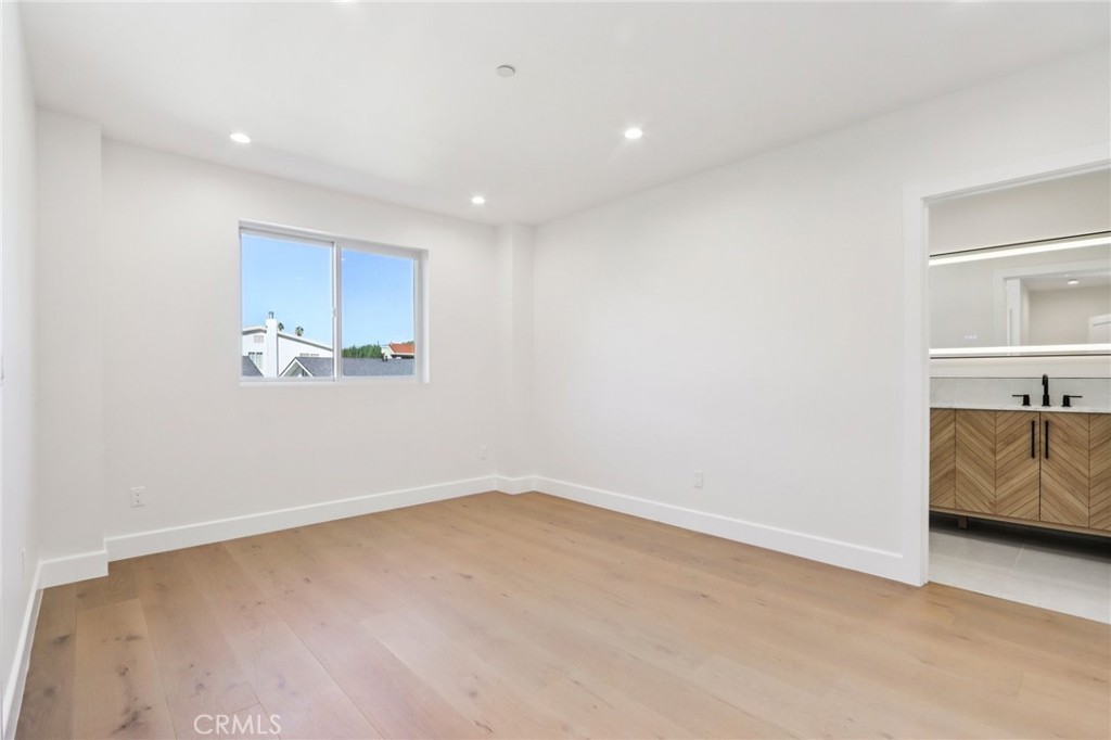 14931 Vose Street Van Nuys, CA 91405 - Photo 24 of 51 a view of a kitchen with cabinets and wooden floor