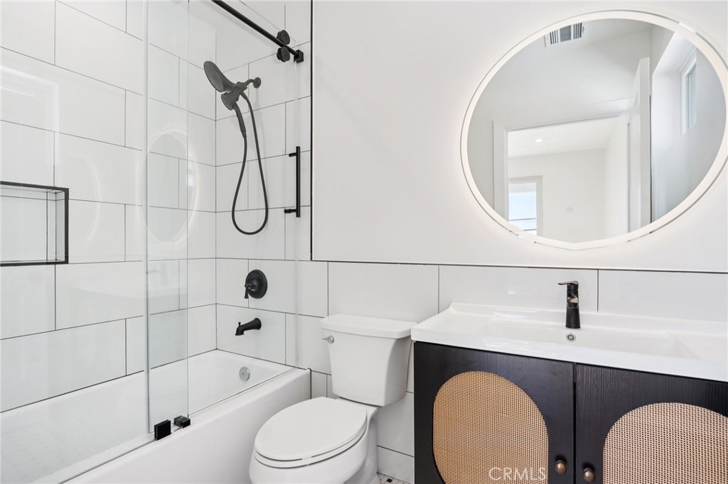 14931 Vose Street Van Nuys, CA 91405 - Photo 31 of 51 a bathroom with a sink toilet and shower