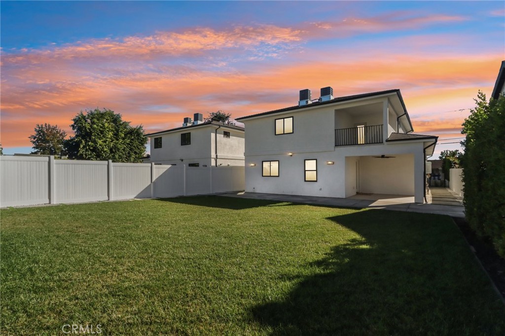 14931 Vose Street Van Nuys, CA 91405 - Photo 50 of 51 a front view of a house with a yard