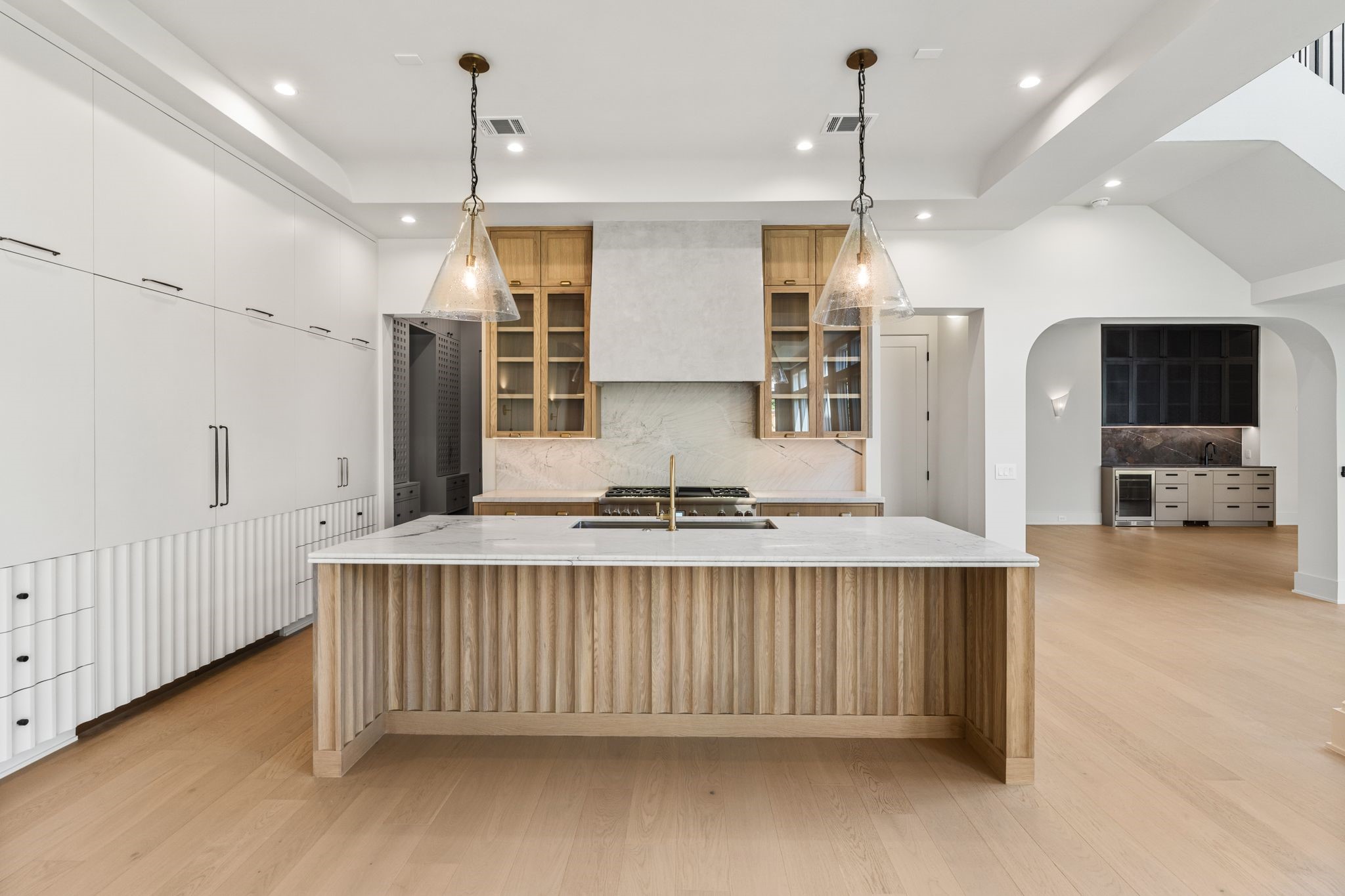 1616 Hazard Street Houston, TX 77019 - Photo 11 of 50 The sleek kitchen features wood paneled Thermador appliances.
